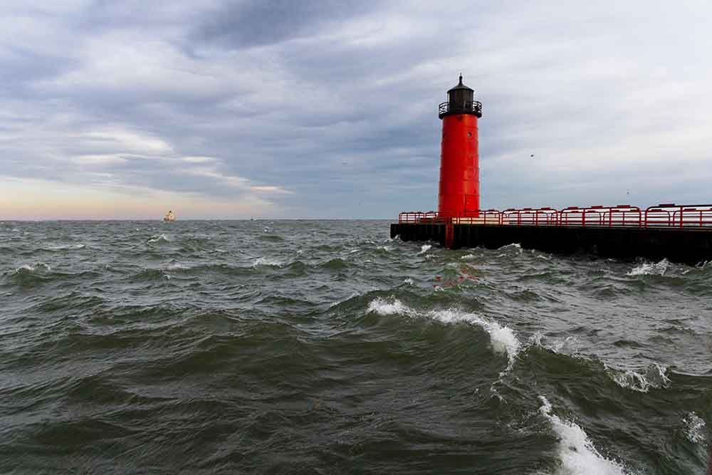 Waves by Milwaukee harbor of pierhead lighthouse