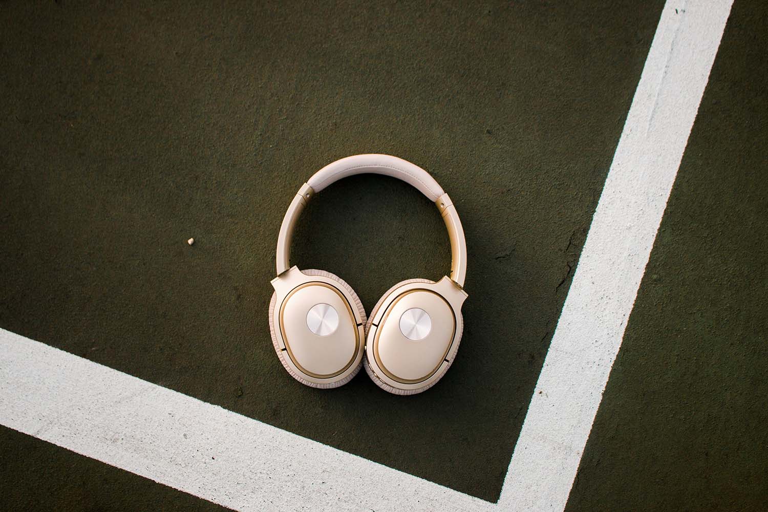 Photo of Cowin Headphones on Tennis Court